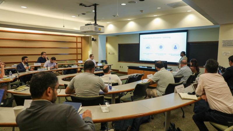 Group of people listening to a presentation in a classroom